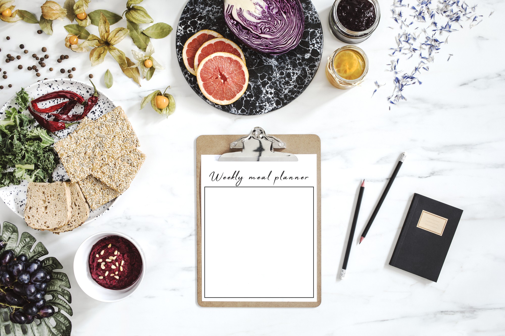 Consultation notes and plated sample on wooden board